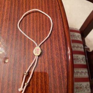 Ralph Lauren Gold and Pink Bracelet with Sophisticated Charm